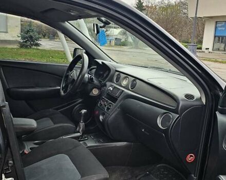 Черный Мицубиси Аутлендер, объемом двигателя 2 л и пробегом 200 тыс. км за 4900 $, фото 7 на Automoto.ua