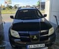 Черный Мицубиси Аутлендер, объемом двигателя 2.4 л и пробегом 270 тыс. км за 6900 $, фото 1 на Automoto.ua