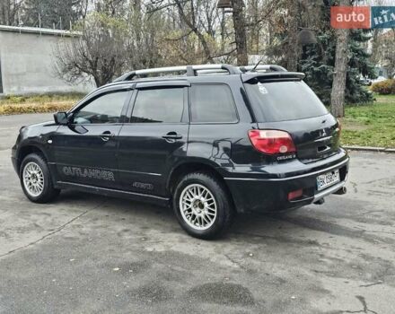 Черный Мицубиси Аутлендер, объемом двигателя 2 л и пробегом 200 тыс. км за 4900 $, фото 11 на Automoto.ua