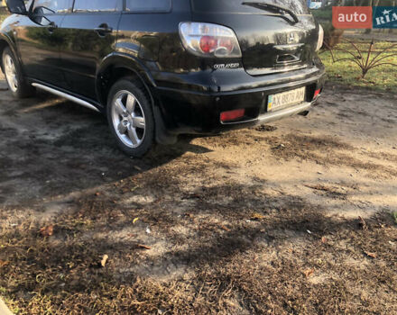 Черный Мицубиси Аутлендер, объемом двигателя 2.4 л и пробегом 260 тыс. км за 7200 $, фото 13 на Automoto.ua