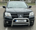 Чорний Міцубісі Аутлендер, об'ємом двигуна 2.38 л та пробігом 198 тис. км за 7100 $, фото 1 на Automoto.ua