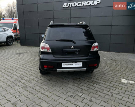 Черный Мицубиси Аутлендер, объемом двигателя 2.4 л и пробегом 248 тыс. км за 7300 $, фото 20 на Automoto.ua