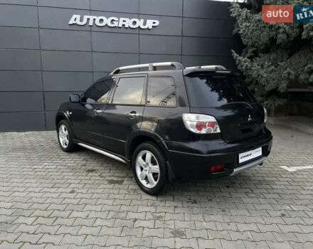 Черный Мицубиси Аутлендер, объемом двигателя 2.4 л и пробегом 248 тыс. км за 7300 $, фото 18 на Automoto.ua