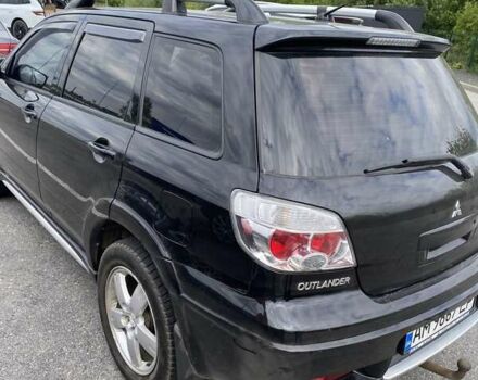 Черный Мицубиси Аутлендер, объемом двигателя 2.4 л и пробегом 270 тыс. км за 6900 $, фото 4 на Automoto.ua