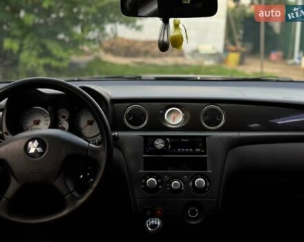 Чорний Міцубісі Аутлендер, об'ємом двигуна 2 л та пробігом 280 тис. км за 7500 $, фото 10 на Automoto.ua