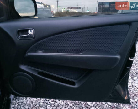 Чорний Міцубісі Аутлендер, об'ємом двигуна 2 л та пробігом 271 тис. км за 6940 $, фото 20 на Automoto.ua