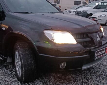 Черный Мицубиси Аутлендер, объемом двигателя 2 л и пробегом 271 тыс. км за 6940 $, фото 12 на Automoto.ua