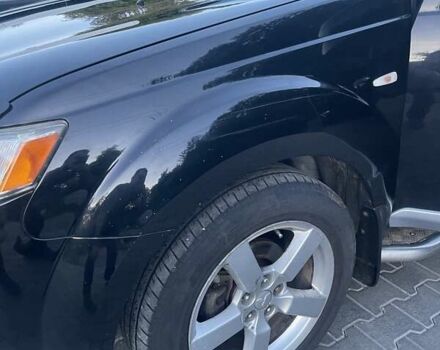 Черный Мицубиси Аутлендер, объемом двигателя 2.4 л и пробегом 290 тыс. км за 9500 $, фото 2 на Automoto.ua