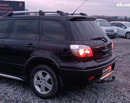 Черный Мицубиси Аутлендер, объемом двигателя 2 л и пробегом 271 тыс. км за 6940 $, фото 5 на Automoto.ua