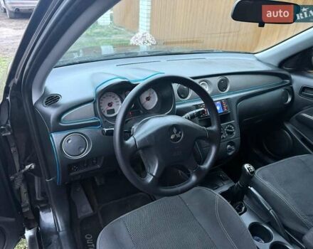 Черный Мицубиси Аутлендер, объемом двигателя 2 л и пробегом 232 тыс. км за 7000 $, фото 12 на Automoto.ua