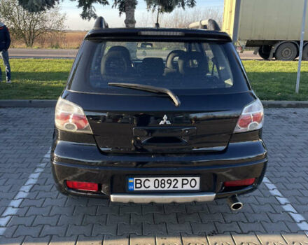 Чорний Міцубісі Аутлендер, об'ємом двигуна 2 л та пробігом 218 тис. км за 6300 $, фото 4 на Automoto.ua