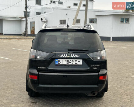 Черный Мицубиси Аутлендер, объемом двигателя 2.4 л и пробегом 230 тыс. км за 6650 $, фото 11 на Automoto.ua