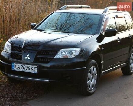 Черный Мицубиси Аутлендер, объемом двигателя 2 л и пробегом 190 тыс. км за 6900 $, фото 24 на Automoto.ua