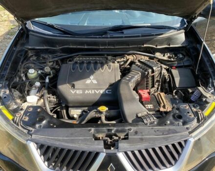 Черный Мицубиси Аутлендер, объемом двигателя 3 л и пробегом 150 тыс. км за 400 $, фото 4 на Automoto.ua