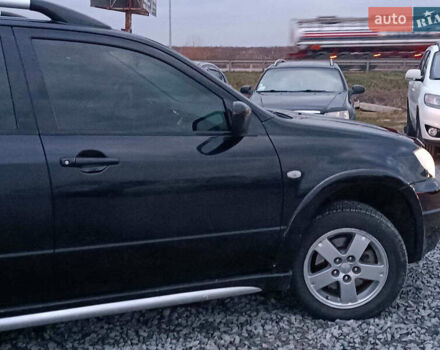 Чорний Міцубісі Аутлендер, об'ємом двигуна 2 л та пробігом 271 тис. км за 6940 $, фото 10 на Automoto.ua