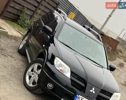 Черный Мицубиси Аутлендер, объемом двигателя 2.4 л и пробегом 178 тыс. км за 6900 $, фото 1 на Automoto.ua