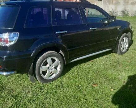 Чорний Міцубісі Аутлендер, об'ємом двигуна 2.38 л та пробігом 161 тис. км за 7500 $, фото 7 на Automoto.ua