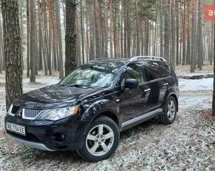 Черный Мицубиси Аутлендер, объемом двигателя 2.4 л и пробегом 228 тыс. км за 10400 $, фото 1 на Automoto.ua