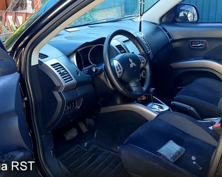 Черный Мицубиси Аутлендер, объемом двигателя 2.4 л и пробегом 184 тыс. км за 7500 $, фото 6 на Automoto.ua