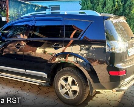 Черный Мицубиси Аутлендер, объемом двигателя 2.4 л и пробегом 184 тыс. км за 7500 $, фото 4 на Automoto.ua