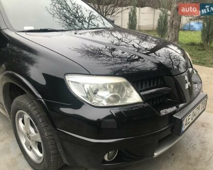 Чорний Міцубісі Аутлендер, об'ємом двигуна 2.38 л та пробігом 207 тис. км за 7000 $, фото 14 на Automoto.ua