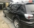 Чорний Міцубісі Аутлендер, об'ємом двигуна 2.38 л та пробігом 207 тис. км за 7000 $, фото 4 на Automoto.ua