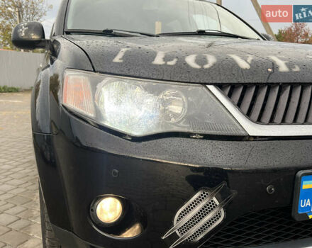 Черный Мицубиси Аутлендер, объемом двигателя 2.4 л и пробегом 230 тыс. км за 6650 $, фото 69 на Automoto.ua