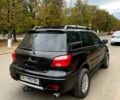 Черный Мицубиси Аутлендер, объемом двигателя 2 л и пробегом 250 тыс. км за 6100 $, фото 2 на Automoto.ua