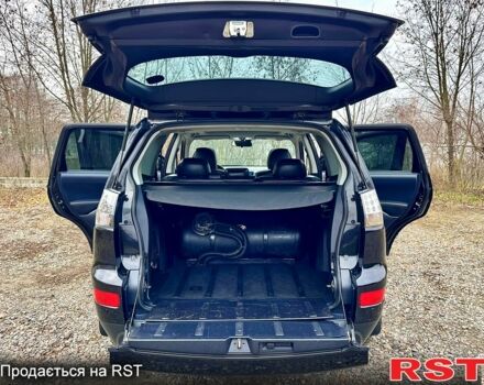 Черный Мицубиси Аутлендер, объемом двигателя 2.4 л и пробегом 229 тыс. км за 9790 $, фото 13 на Automoto.ua