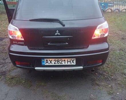 Черный Мицубиси Аутлендер, объемом двигателя 2.4 л и пробегом 270 тыс. км за 6700 $, фото 3 на Automoto.ua