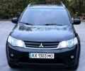 Черный Мицубиси Аутлендер, объемом двигателя 2.4 л и пробегом 210 тыс. км за 7800 $, фото 1 на Automoto.ua