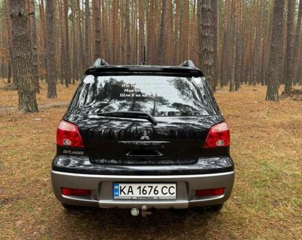 Черный Мицубиси Аутлендер, объемом двигателя 2 л и пробегом 232 тыс. км за 7000 $, фото 4 на Automoto.ua