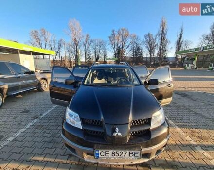 Черный Мицубиси Аутлендер, объемом двигателя 2 л и пробегом 190 тыс. км за 8000 $, фото 5 на Automoto.ua