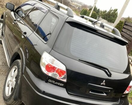 Черный Мицубиси Аутлендер, объемом двигателя 2.4 л и пробегом 178 тыс. км за 6900 $, фото 16 на Automoto.ua