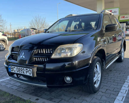 Чорний Міцубісі Аутлендер, об'ємом двигуна 2 л та пробігом 218 тис. км за 6300 $, фото 7 на Automoto.ua