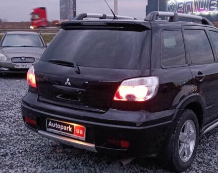 Черный Мицубиси Аутлендер, объемом двигателя 2 л и пробегом 271 тыс. км за 6940 $, фото 7 на Automoto.ua