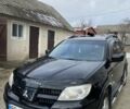 Чорний Міцубісі Аутлендер, об'ємом двигуна 2 л та пробігом 196 тис. км за 7000 $, фото 1 на Automoto.ua