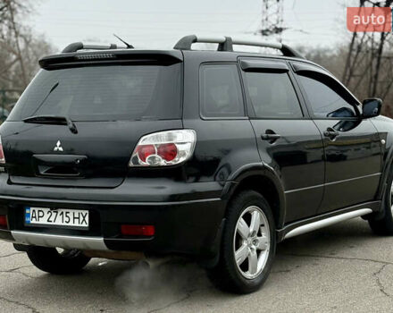 Черный Мицубиси Аутлендер, объемом двигателя 2.4 л и пробегом 245 тыс. км за 6500 $, фото 6 на Automoto.ua