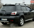 Черный Мицубиси Аутлендер, объемом двигателя 2.4 л и пробегом 245 тыс. км за 6500 $, фото 6 на Automoto.ua