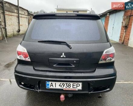 Черный Мицубиси Аутлендер, объемом двигателя 2 л и пробегом 306 тыс. км за 6500 $, фото 3 на Automoto.ua