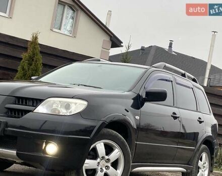 Черный Мицубиси Аутлендер, объемом двигателя 2.4 л и пробегом 178 тыс. км за 6900 $, фото 5 на Automoto.ua