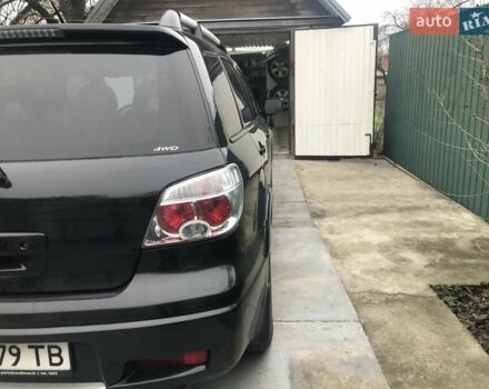 Чорний Міцубісі Аутлендер, об'ємом двигуна 2.38 л та пробігом 207 тис. км за 7000 $, фото 8 на Automoto.ua