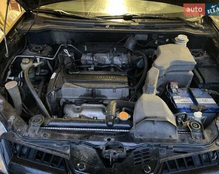 Черный Мицубиси Аутлендер, объемом двигателя 2 л и пробегом 306 тыс. км за 6500 $, фото 23 на Automoto.ua