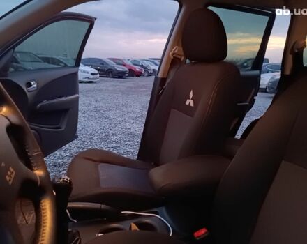 Черный Мицубиси Аутлендер, объемом двигателя 2 л и пробегом 271 тыс. км за 6940 $, фото 30 на Automoto.ua