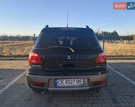 Черный Мицубиси Аутлендер, объемом двигателя 2 л и пробегом 190 тыс. км за 8000 $, фото 2 на Automoto.ua