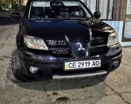 Чорний Міцубісі Аутлендер, об'ємом двигуна 2 л та пробігом 117 тис. км за 7900 $, фото 1 на Automoto.ua