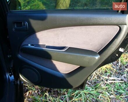 Черный Мицубиси Аутлендер, объемом двигателя 2 л и пробегом 189 тыс. км за 7200 $, фото 57 на Automoto.ua