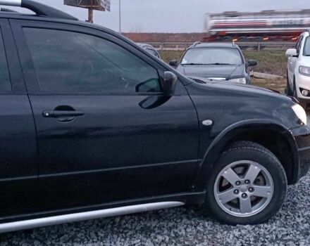 Черный Мицубиси Аутлендер, объемом двигателя 2 л и пробегом 271 тыс. км за 6940 $, фото 10 на Automoto.ua