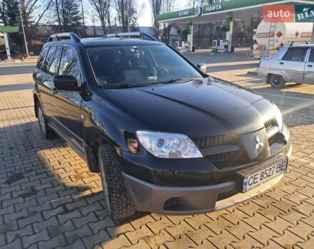 Черный Мицубиси Аутлендер, объемом двигателя 2 л и пробегом 190 тыс. км за 8000 $, фото 4 на Automoto.ua