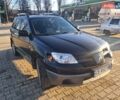 Черный Мицубиси Аутлендер, объемом двигателя 2 л и пробегом 190 тыс. км за 8000 $, фото 4 на Automoto.ua